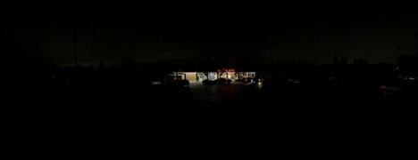Trader Joe's grocery store at night with lights on